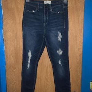 Ripped high rise blue jeans